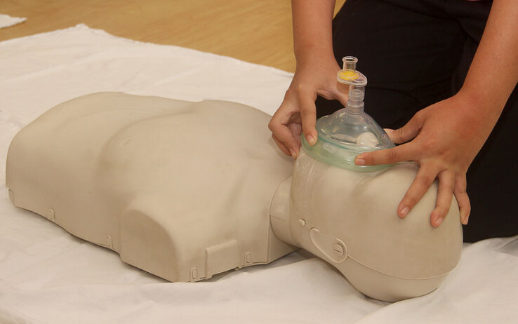 When Using a Pocket Mask, Where Should the Rescuer Be Positioned?